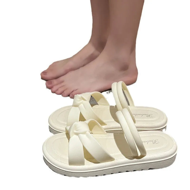 Women's black and white PVC sandals with a soft back, two-way strap design, and a non-slip sole.