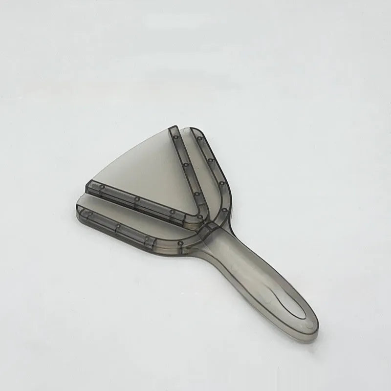 Red plastic telescopic can and bottle opener with non-slip handle on a kitchen counter.