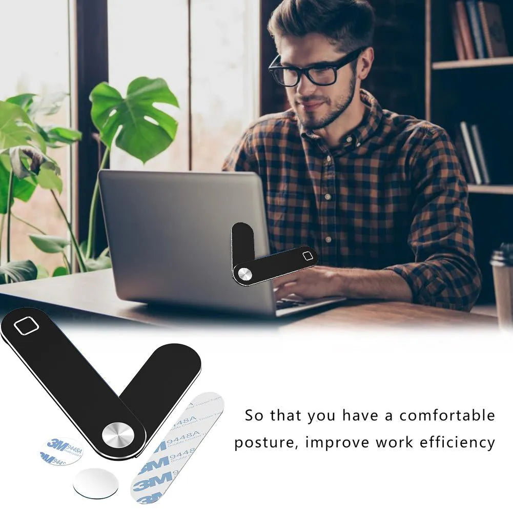 Black aluminum laptop phone holder with magnetic bracket mounted beside computer monitor