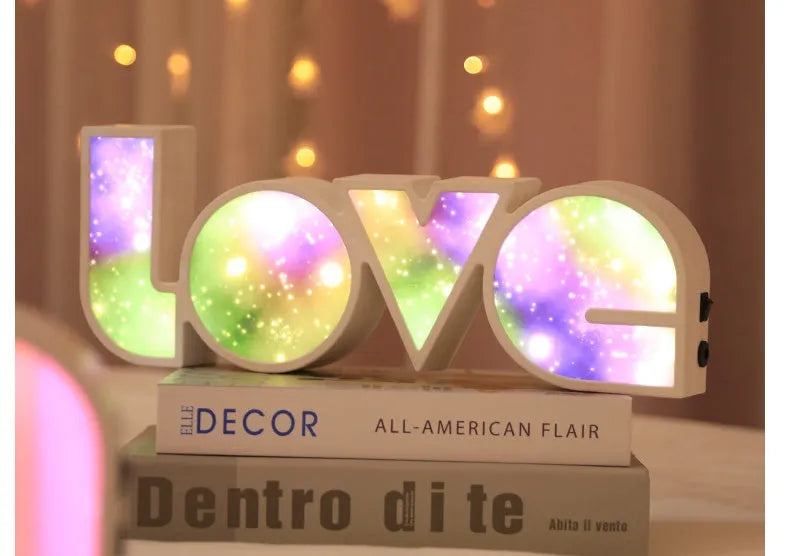 Rainbow LED LOVE decorative light with plastic shell measuring 35.5cm by 13.5cm