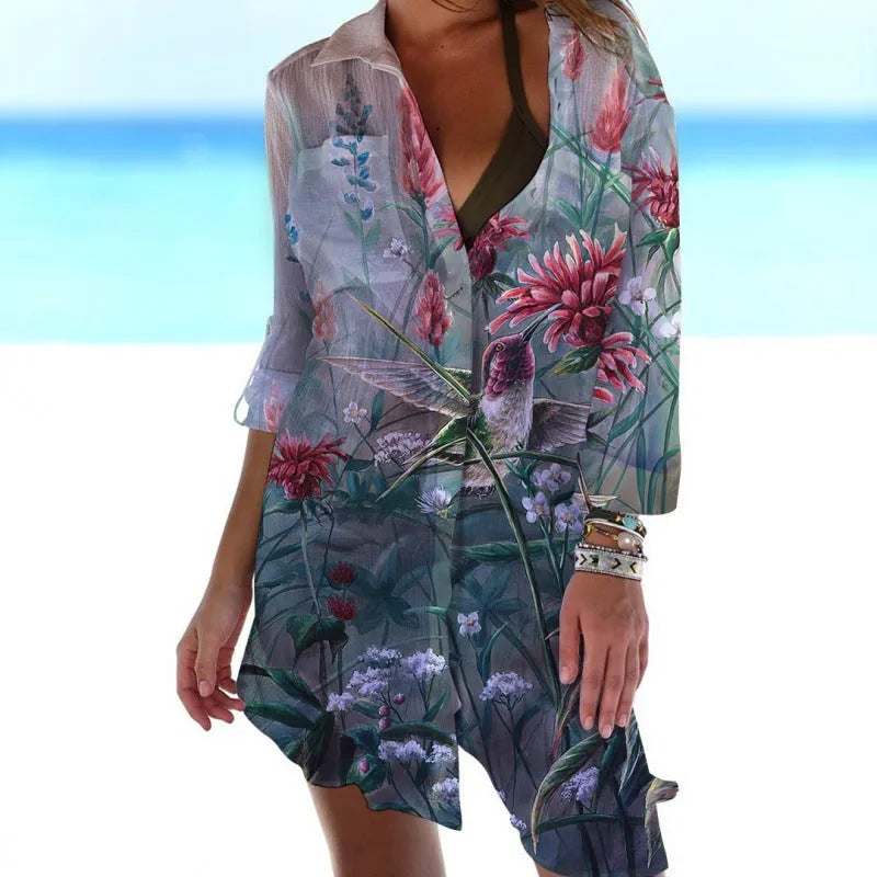 Women's long sleeve polyester cardigan with a colourful 3D bird and flower digital print, shown as a beach cover-up.