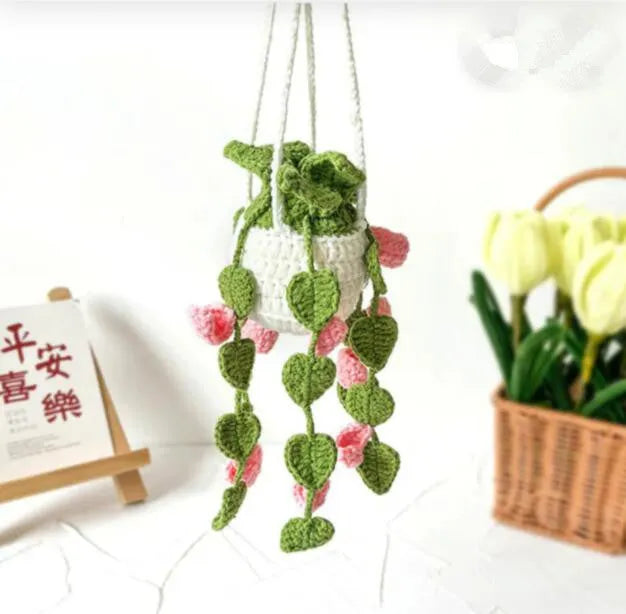 Green and white knitted wool plant ornament for car dashboard with hanging cord