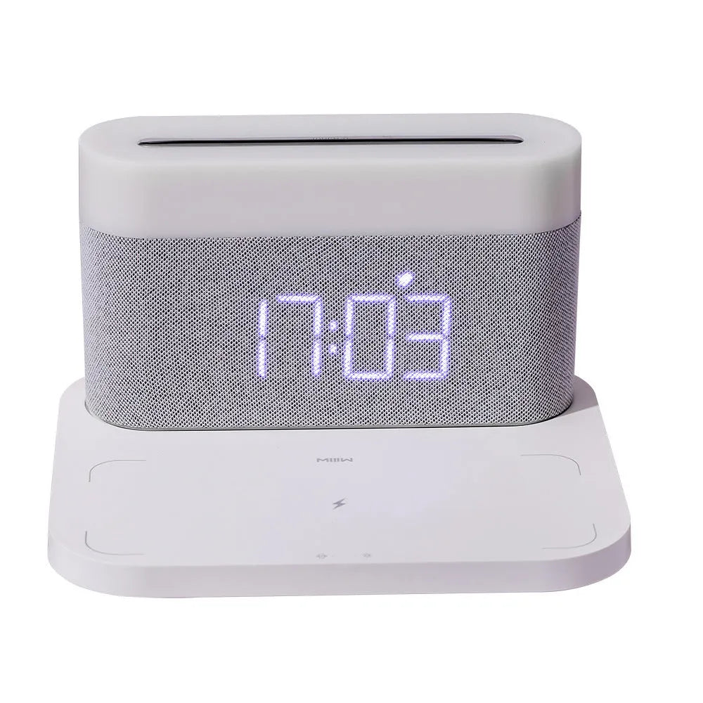 White or black table lamp with integrated wireless phone charger and digital clock display