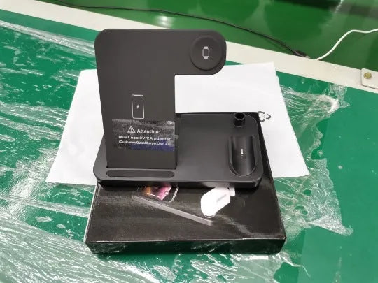 Black folding 4-in-1 wireless charger showing iPhone AirPods and Apple Pencil charging simultaneously