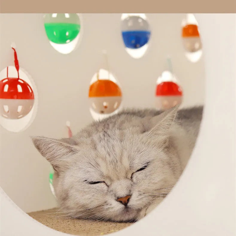 Integrated plastic cat scratch board nest with a tunnel and a hanging bell ball toy.