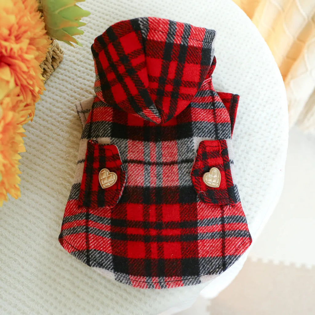 Red plaid dog trench coat shown alongside black houndstooth version, with size chart showing chest circumference measurements