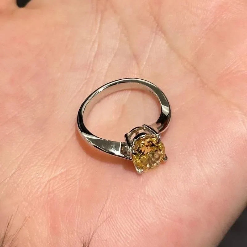 Women's yellow rock sugar crystal ring on copper band showing detail of crystal design