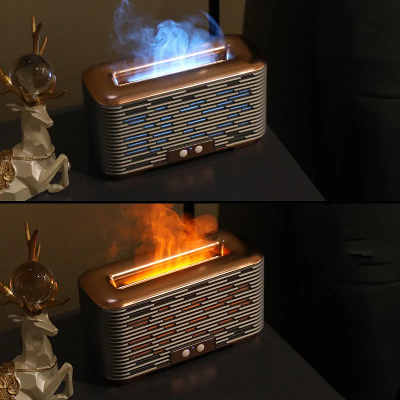 Flame aroma diffuser humidifier in gold with double-colour atmosphere light on a desktop