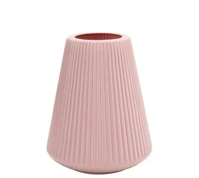 Blue melamine plastic decorative flower vase measuring 16cm by 20cm on a desktop.