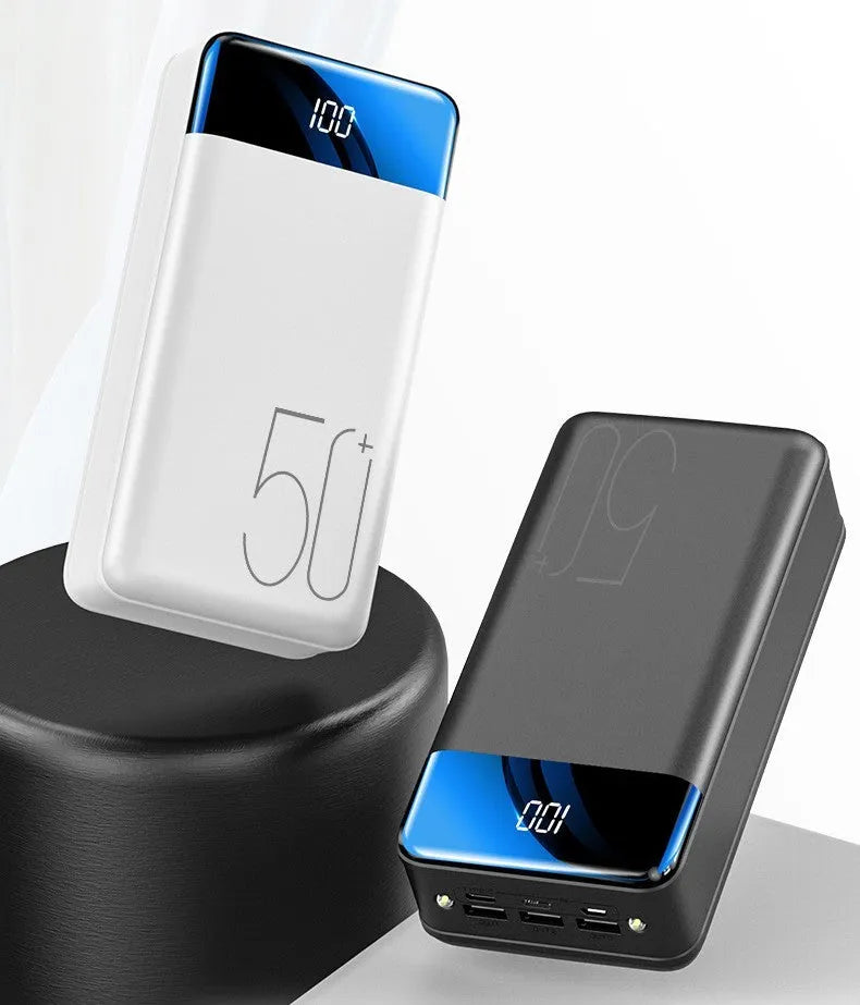 Black and white 50000mAh power bank showing three USB output ports and compact design