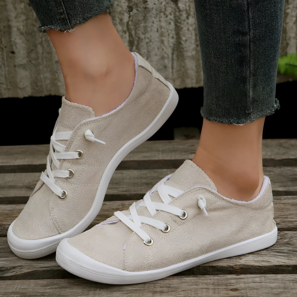 Women's creamy white casual sneakers with soft fabric upper and rubber sole