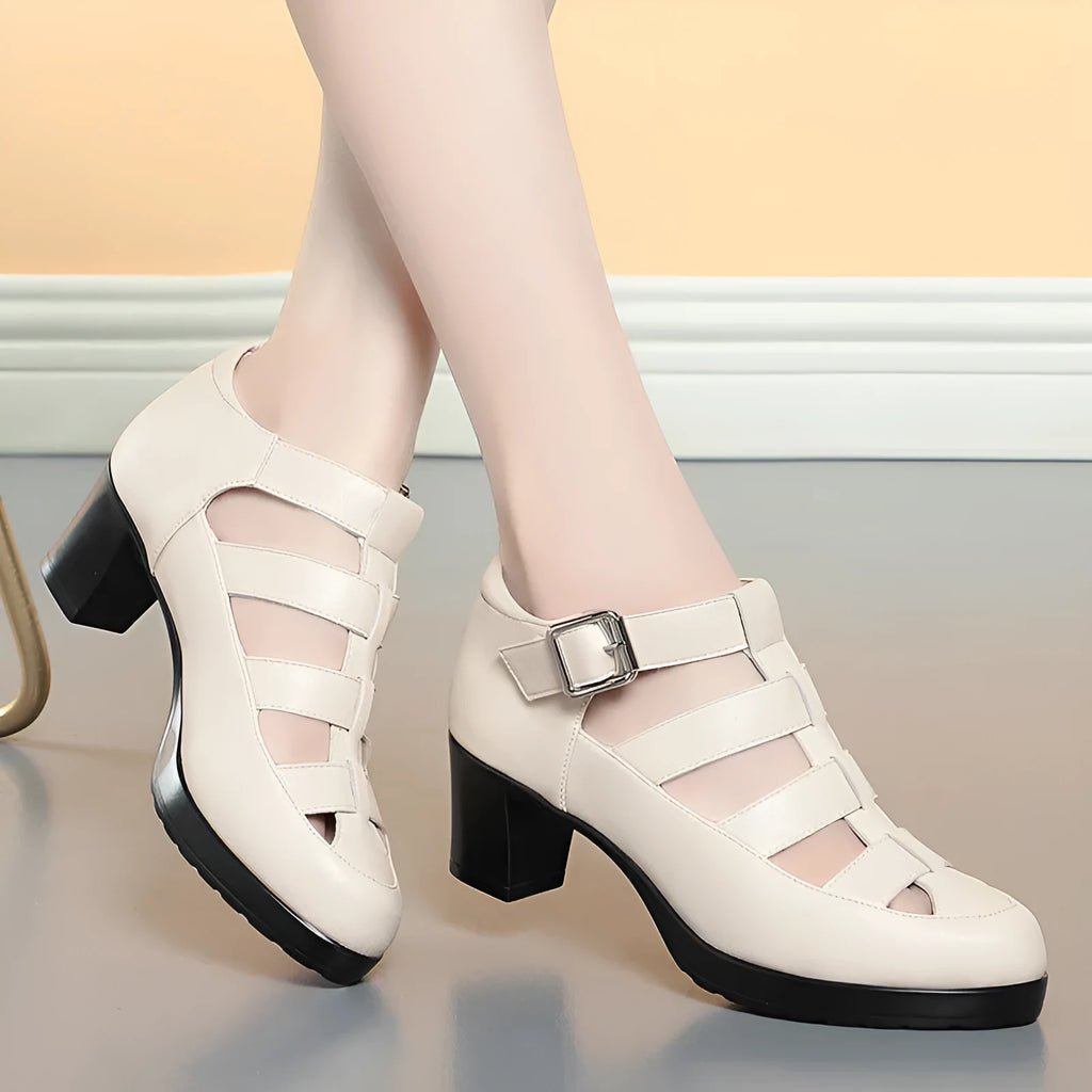 Women's beige closed toe sandals with woven hollowed design, chunky heel, and ankle-strap buckle.