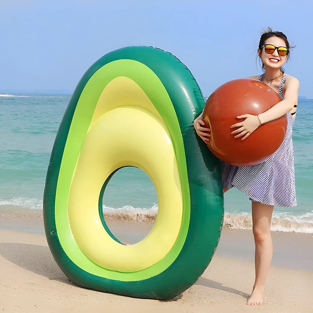 Large green inflatable avocado pool float on blue water, showing its 169cm length.