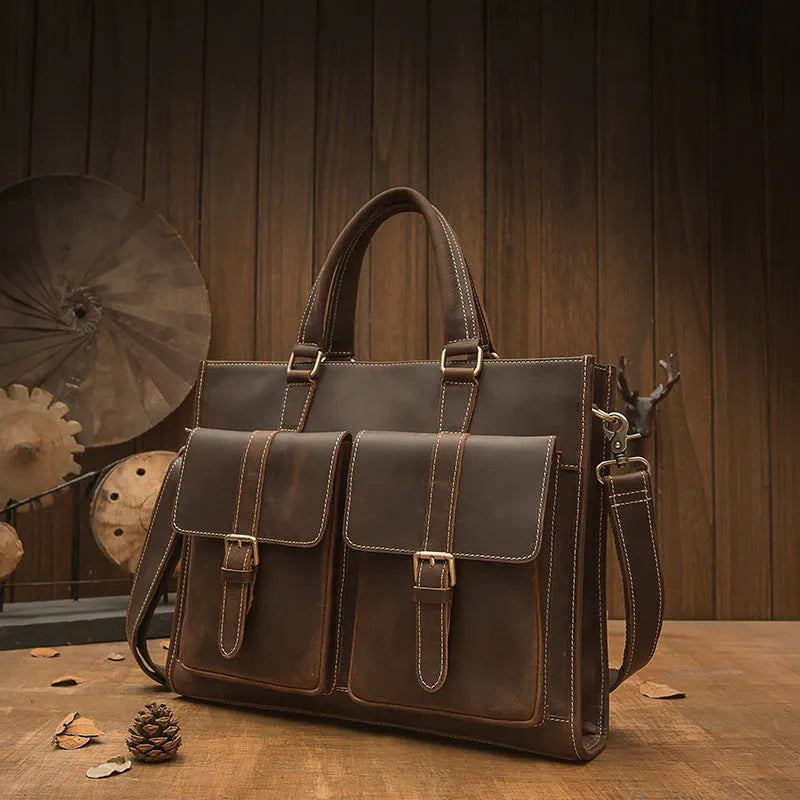 Handmade dark brown leather men's briefcase with top layer cowhide texture holding a 15-inch notebook and folder