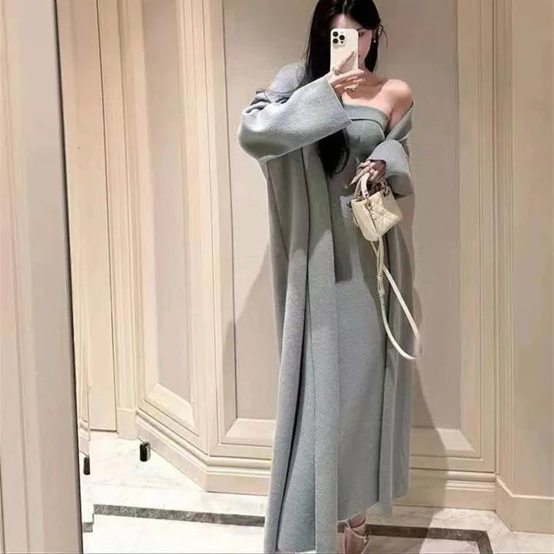 Women's grey knitted cardigan dress and matching coat set on a hanger.