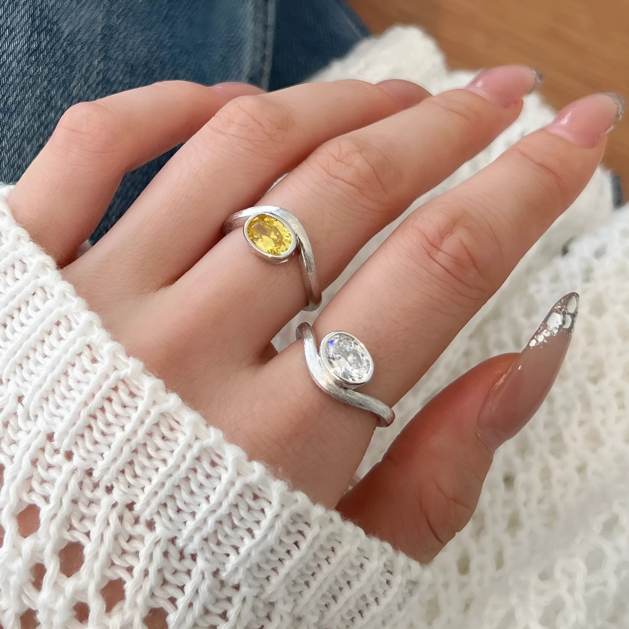Women's simple oval silver ring electroplated platinum white diamond colour on white background