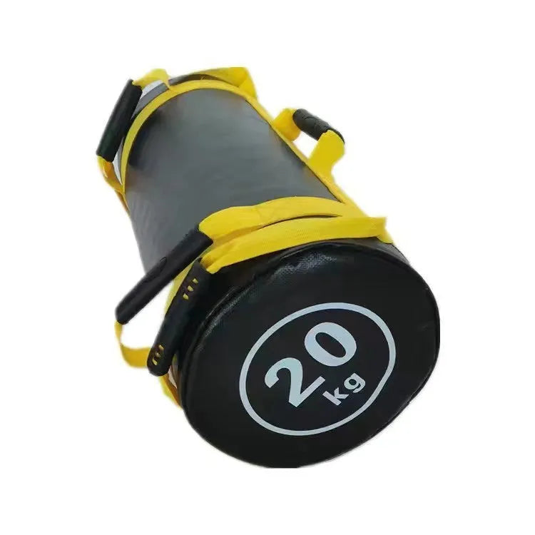 Flat white leather PVC fitness training sandbag for weight lifting on a gym floor.