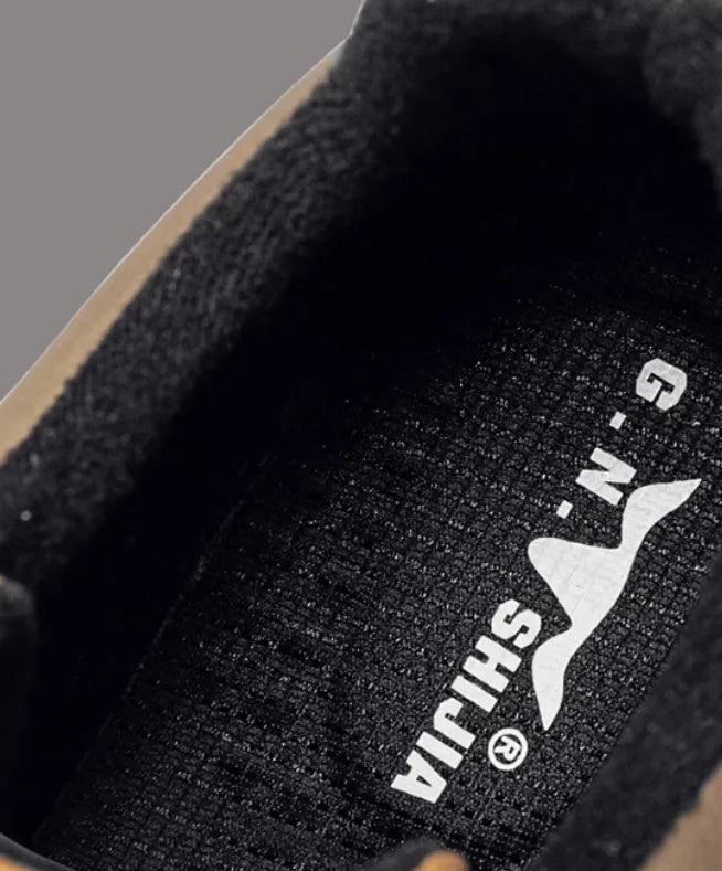Black and white platform casual sneakers with thick rubber soles and colour-panelled pattern detailing