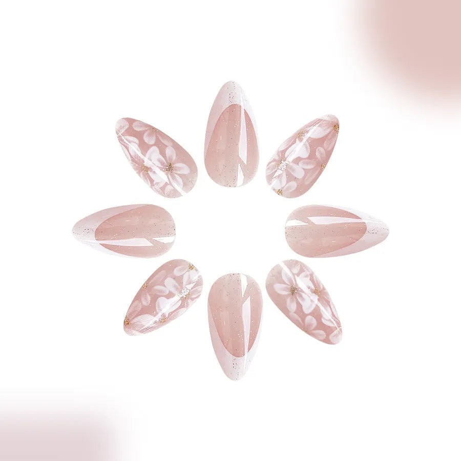 Short almond shaped French style false nails with glitter and floral patterns C625 colour