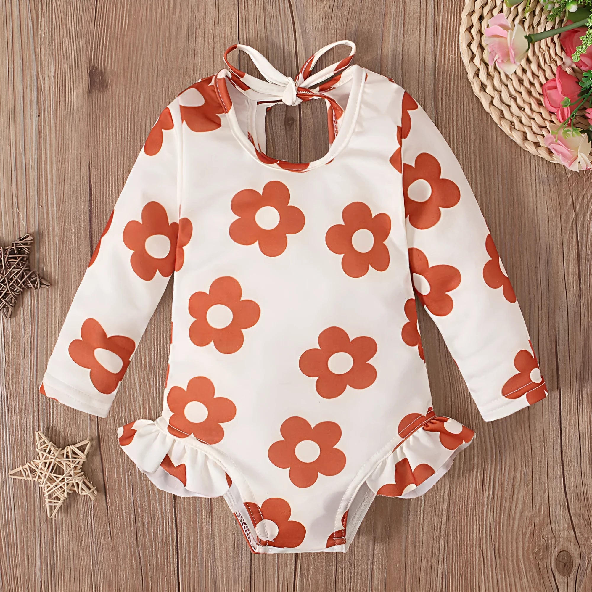 Girl's floral pattern swimsuit with crew neck and open back design in polyester fabric