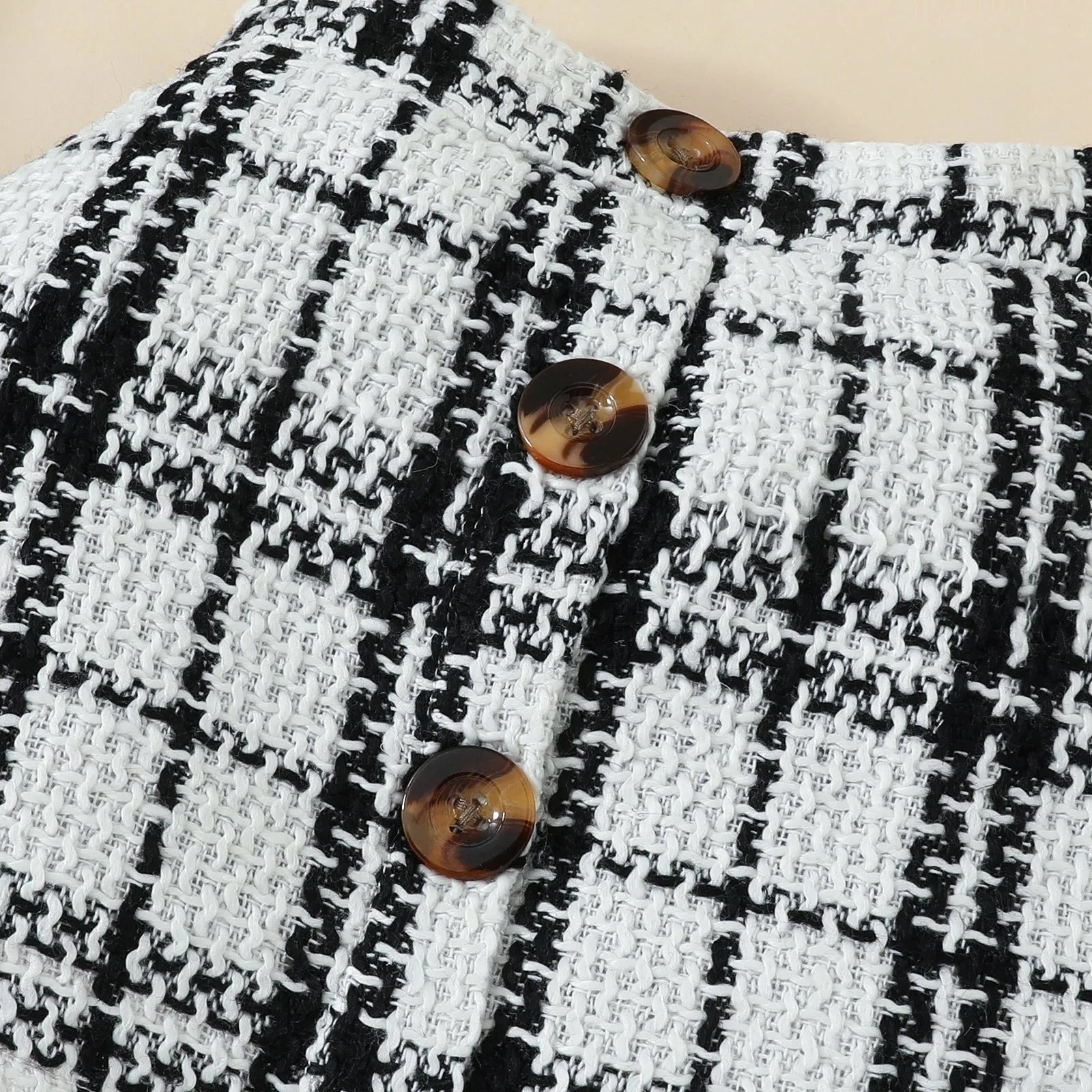Babies' short-sleeved blouse skirt suit in black with plaid pattern, including romper, skirt and hairband