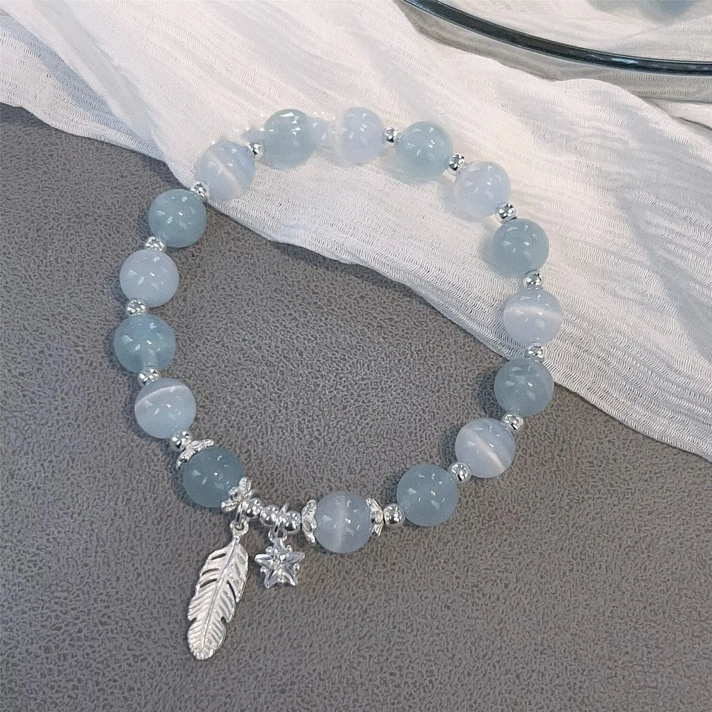 Crystal bracelet with Korean style design featuring letters text in blue moonlight colour