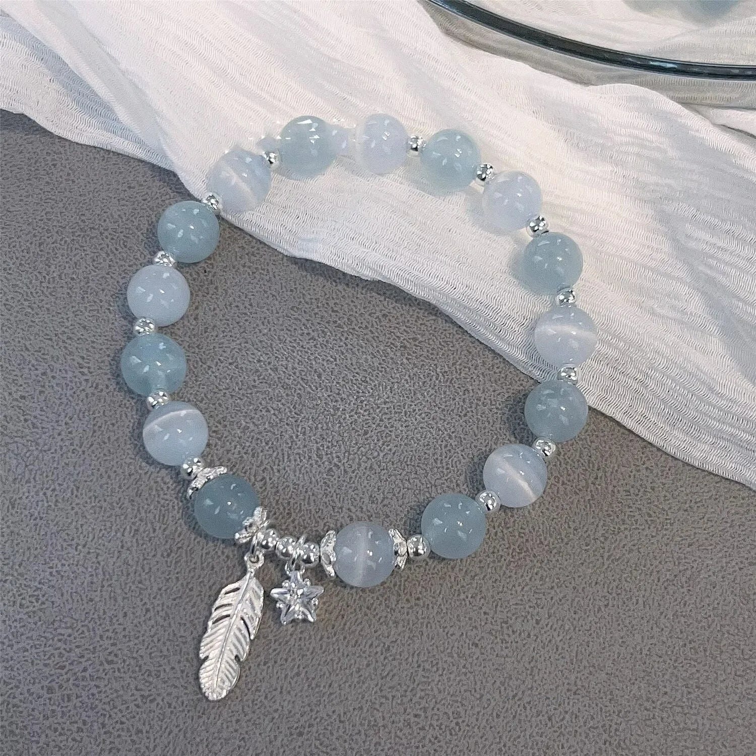 Crystal bracelet with Korean style design featuring letters text in blue moonlight colour