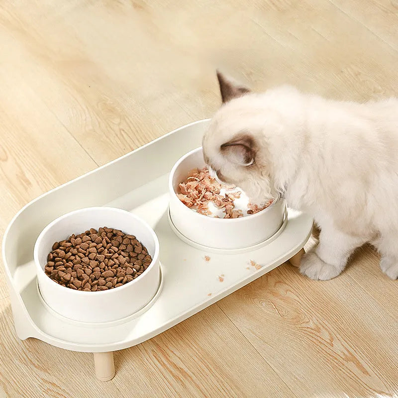 Green adjustable tilted pet feeder with two bowls for cats and dogs