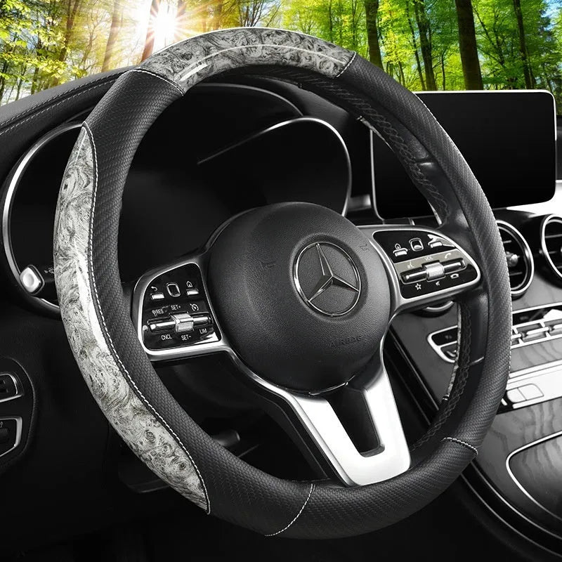 Leather steering wheel cover with crystal texture in black brown colour, round style, on a car steering wheel