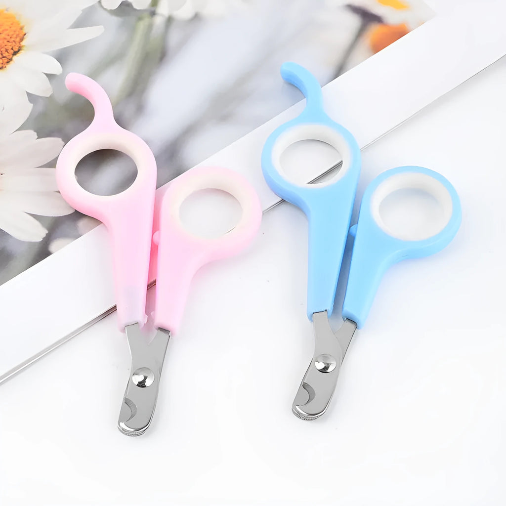 Mini pet nail clippers in plastic, blue white colour, on a light background