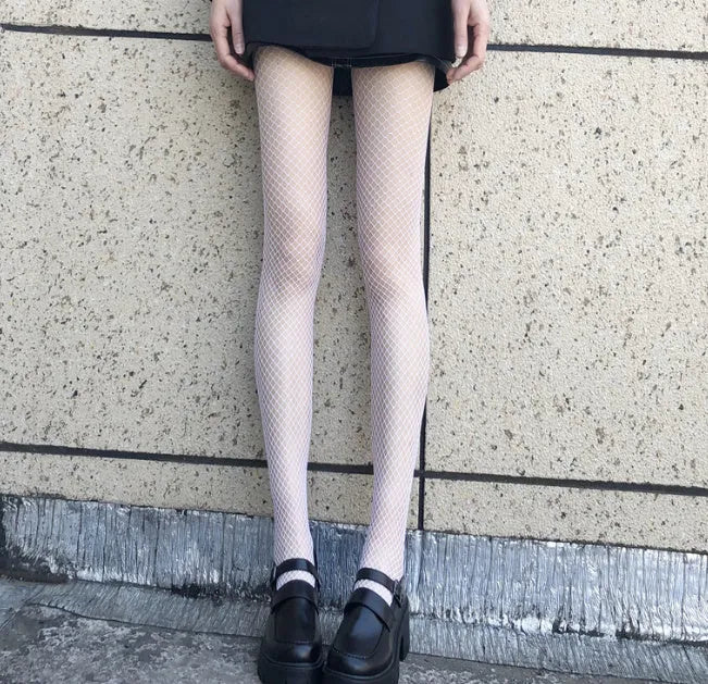 Women's black and white mesh stockings showing large, medium, and small pattern examples.