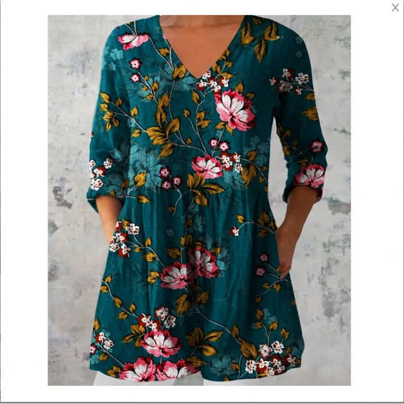 Women's loose-fitting dress with a blue wave print pattern, wide waist, and three-quarter length sleeves.