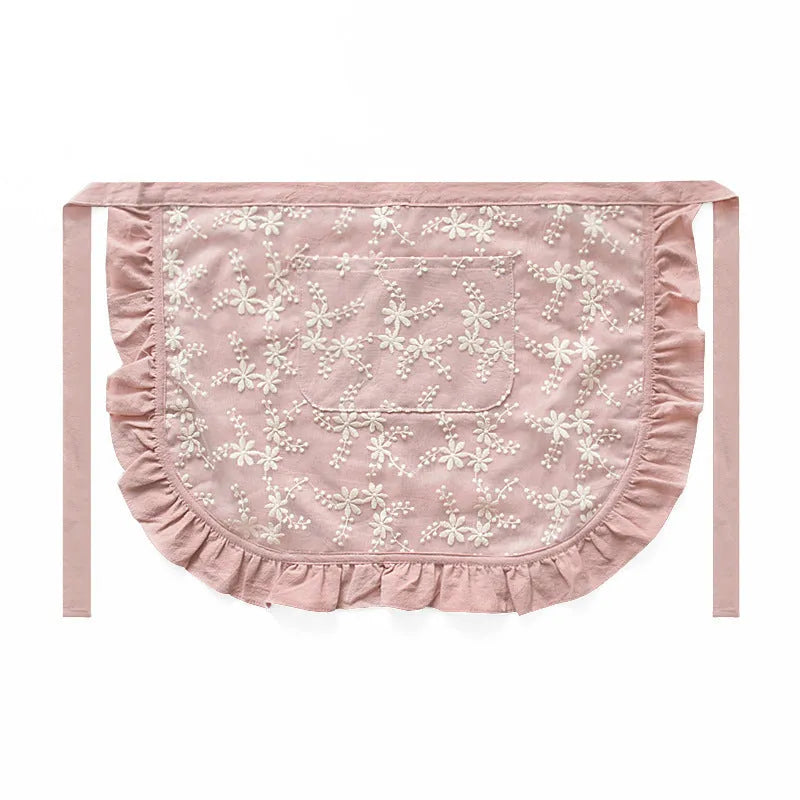 Minimalist cotton linen apron with X-strap design and lace details in light pink colour