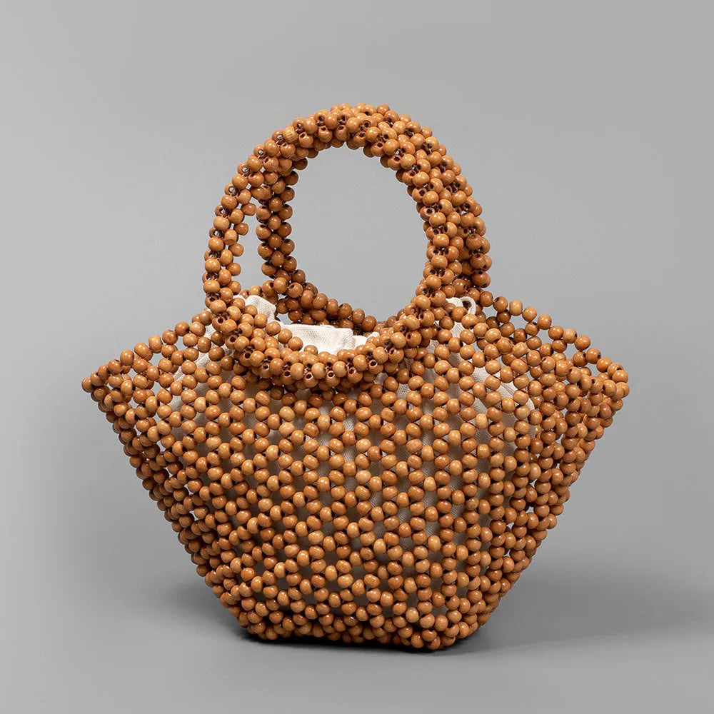 Hand-woven maple beach bag with wooden bead decoration showing hollow dumpling design