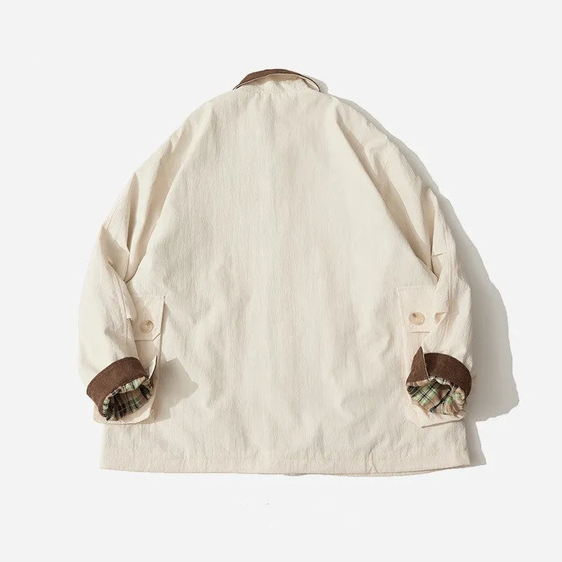 Green casual jacket with side seam pockets on a hanger, showing regular fit and long sleeves.