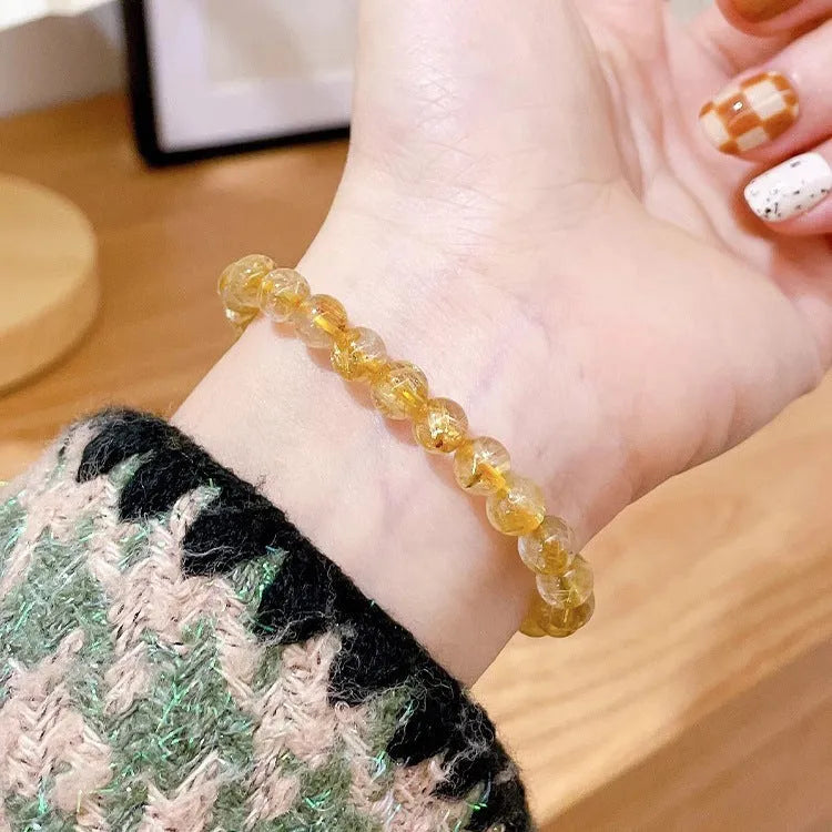 Natural gold rutilated quartz sunstone crystal bracelet with diamond-shaped beads for women