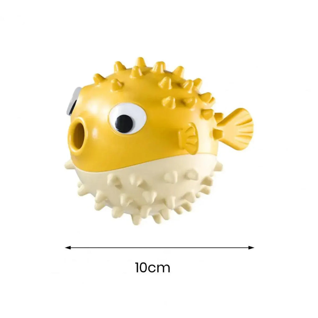 Yellow vinyl fish-shaped squeaky dog chew toy on a plain background