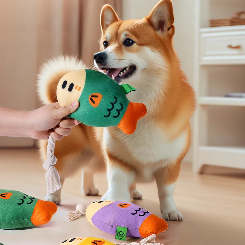 Puffhead Fish plush squeaky dog toy in green, purple, and yellow colours