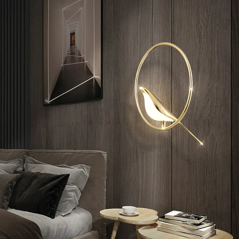 Minimalist clear acrylic magpie bird chandelier ceiling light with a metallic frame.