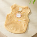 Green knitted cat clothes with a hollowed-out bear patch cartoon design.