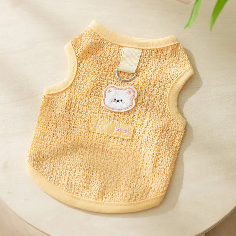 Green knitted cat clothes with a hollowed-out bear patch cartoon design.