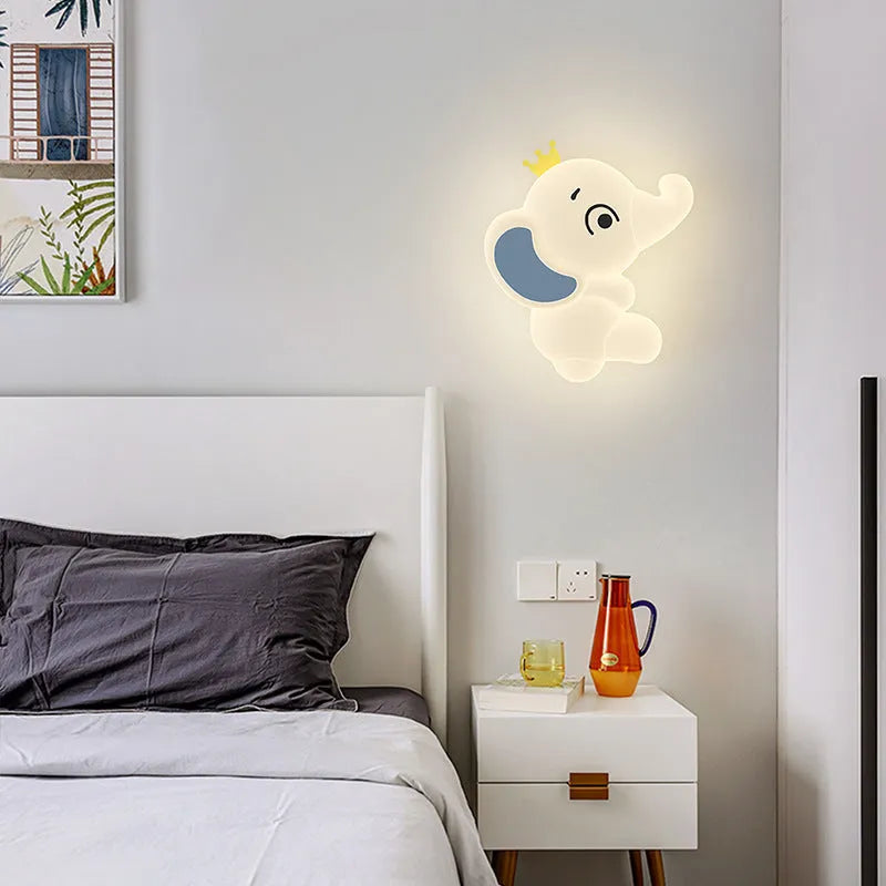 White cartoon elephant wall light with tricolour dimming, 22cm balloon elephant design, on a wall in a child's room