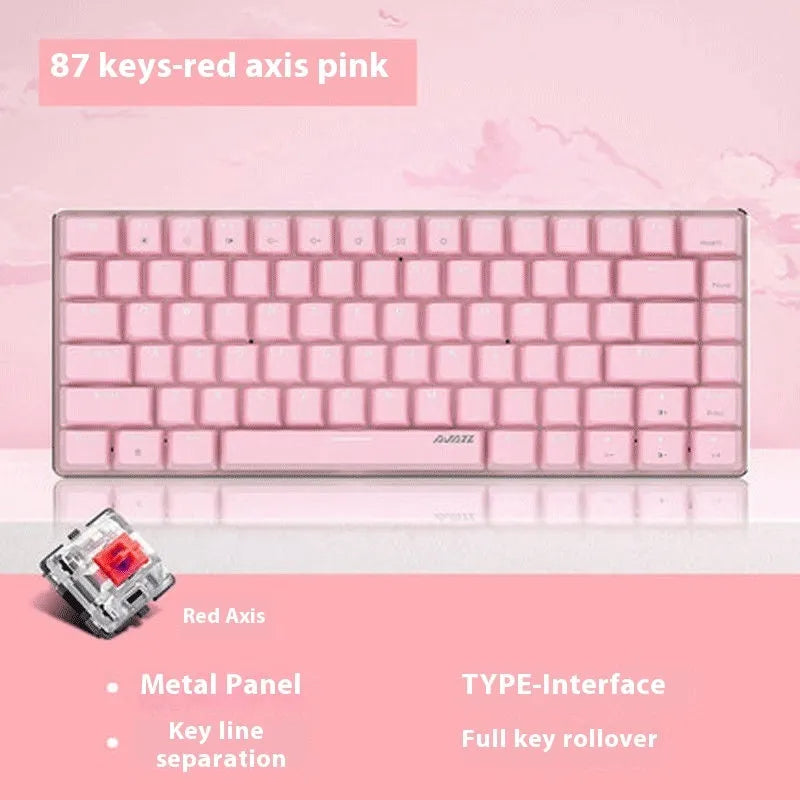 Compact white-backlit mechanical keyboard with 82 keys and metal body next to a laptop.