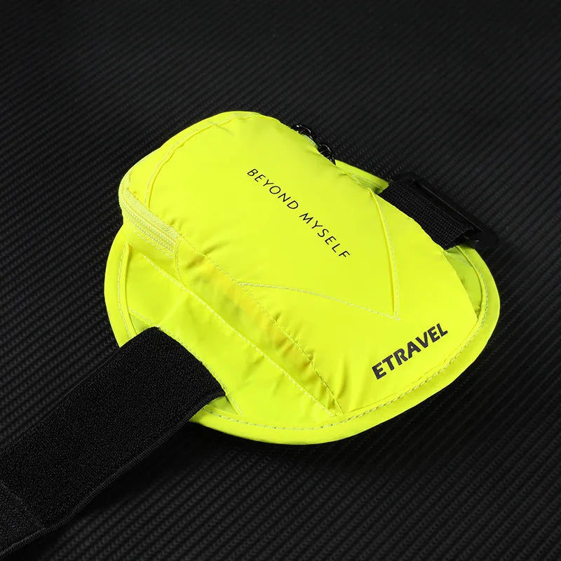 Black reflective running arm bag with adjustable strap, shown on an arm.