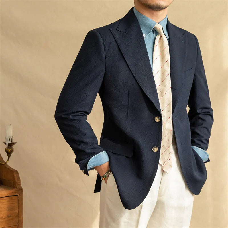 Half-lined seersucker gun lapel jacket in white with double-breasted buttons and long sleeves