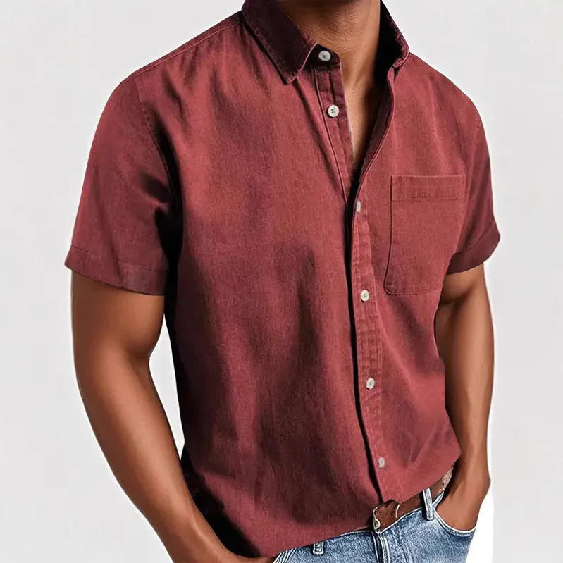 Men's solid colour short-sleeved polo shirt with a classic collar and a single chest pocket.