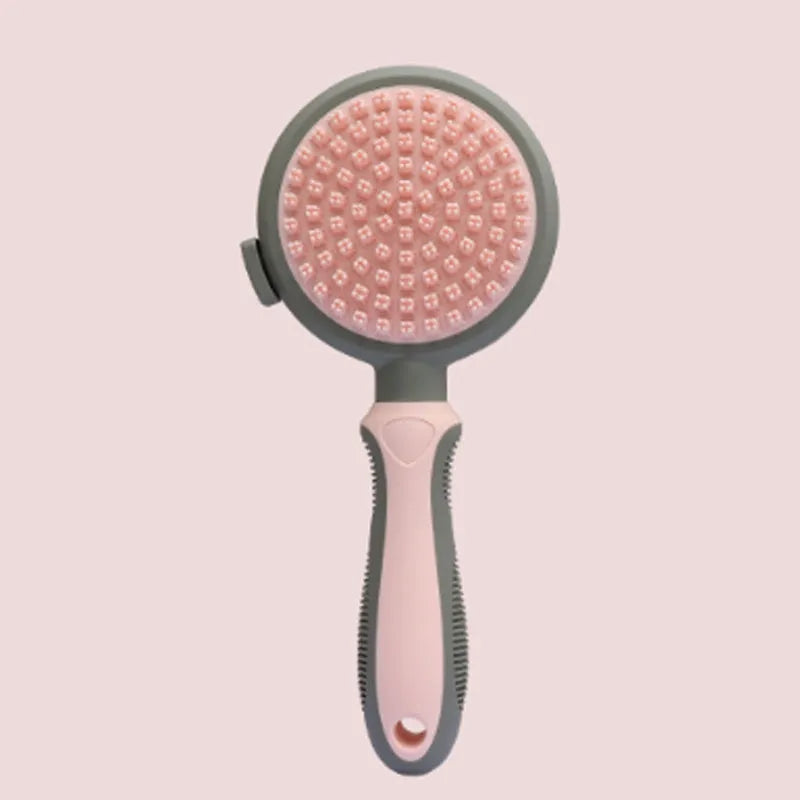 Green and pink 2-in-1 silicone cat hair brush with retractable slicker brush and massaging head.