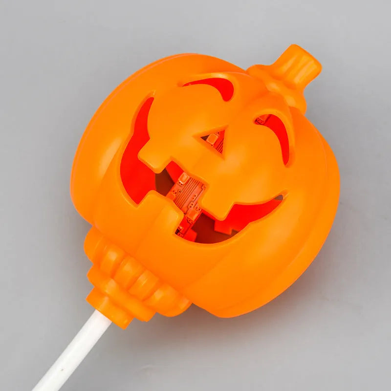 Plastic pumpkin lamp with USB power cable showing yellow or purple light options
