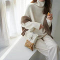 Women's high-neck loose knit pullover sweater in solid colour with long sleeves and one-size fit
