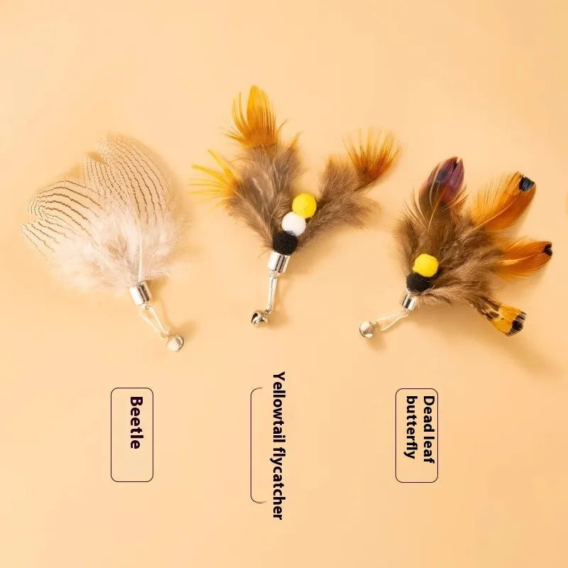 Three steel wire cat toy replacement heads with small flying insect designs on a white background.